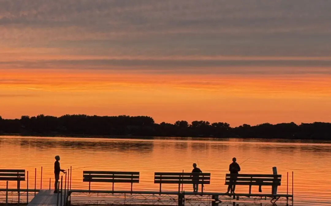 Brothers fishing at sunset